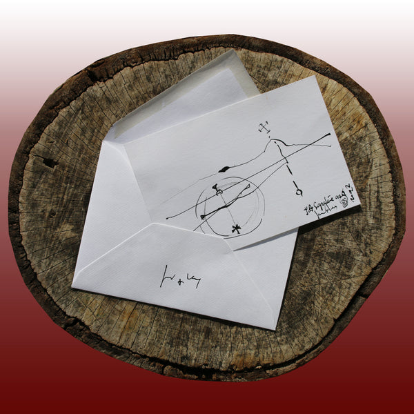 On the log : In the foreground the JA.SIGNATURE N°6  paper card - below the the back side of the James Arax Signature.