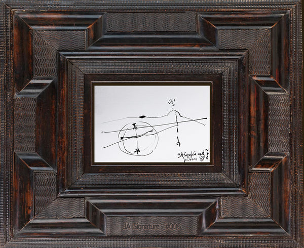 The paper card JA.SIGNATURE N°6 by james arax staged in an ancient frame.